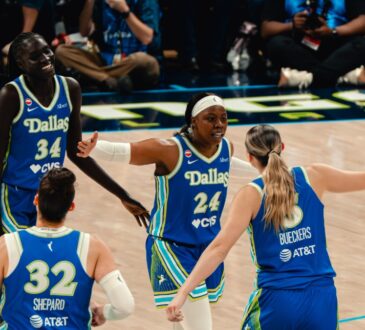 Dallas Wings players Awak Kuier, Jessica Shepard, Arike Ogunbowale, and Paige Bueckers celebrate during a WNBA game against the Las Vegas Aces at College Park Center in Arlington, Texas, on June 15, 2026.