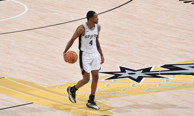 De'Aaron Fox #4 of the San Antonio Spurs drives with the ball during Game 5 of the 2026 NBA Finals against the New York Knicks at Frost Bank Center on June 13, 2026.