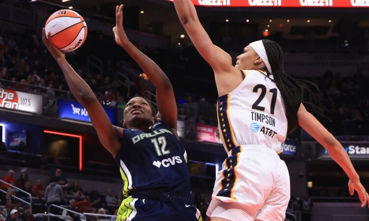 Dallas Wings' Dulcy Fankam Mendjiadeu goes up for a shot against Indiana Fever's Makayla Timpson during a preseason game at Gainbridge Fieldhouse on April 30, 2026, in Indianapolis, Indiana.
