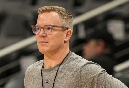 Dusty May, hired as Dallas Mavericks head coach, looks on during a Michigan practice at the NCAA Tournament