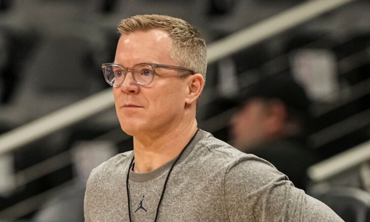 Dusty May, hired as Dallas Mavericks head coach, looks on during a Michigan practice at the NCAA Tournament