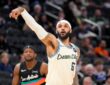 Milwaukee Bucks guard Gary Trent Jr. follows through on a jump shot against the San Antonio Spurs at Fiserv Forum.