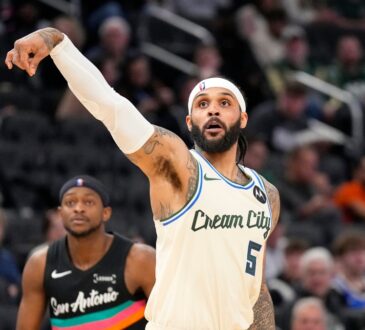 Milwaukee Bucks guard Gary Trent Jr. follows through on a jump shot against the San Antonio Spurs at Fiserv Forum.