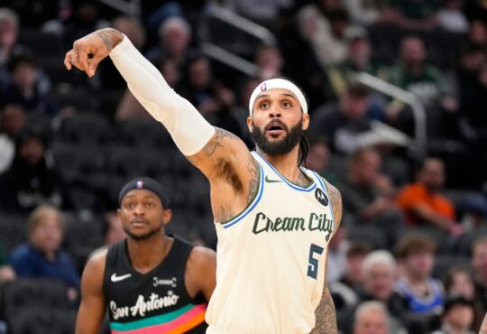 Milwaukee Bucks guard Gary Trent Jr. follows through on a jump shot against the San Antonio Spurs at Fiserv Forum.