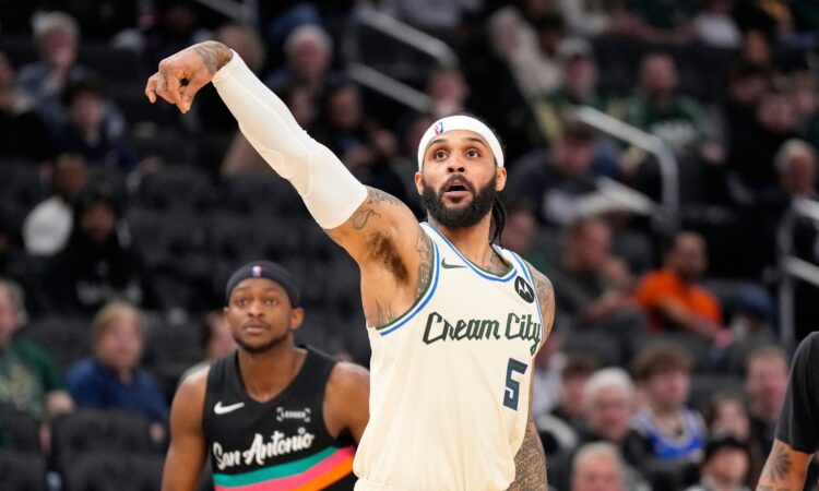 Milwaukee Bucks guard Gary Trent Jr. follows through on a jump shot against the San Antonio Spurs at Fiserv Forum.