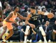 Giannis Antetokounmpo #34 of the Milwaukee Bucks drives to the basket against Evan Mobley #4 of the Cleveland Cavaliers at Rocket Arena.