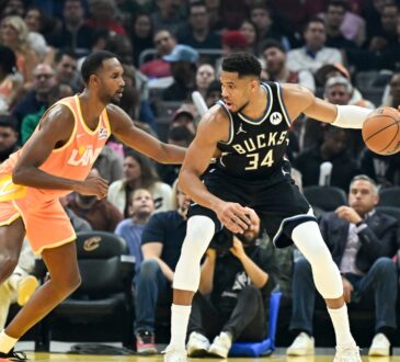 Giannis Antetokounmpo #34 of the Milwaukee Bucks drives to the basket against Evan Mobley #4 of the Cleveland Cavaliers at Rocket Arena.