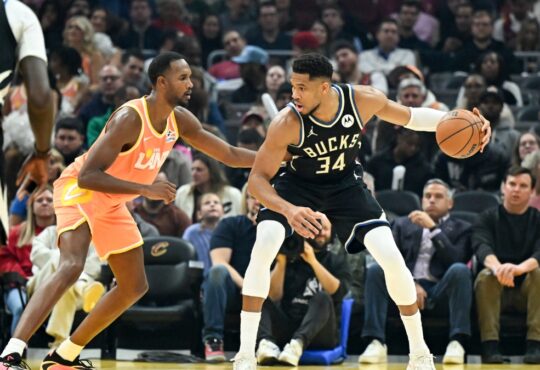 Giannis Antetokounmpo #34 of the Milwaukee Bucks drives to the basket against Evan Mobley #4 of the Cleveland Cavaliers at Rocket Arena.