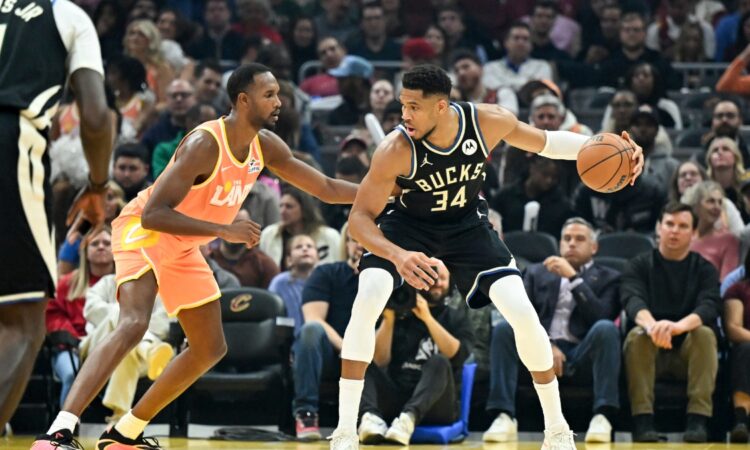 Giannis Antetokounmpo #34 of the Milwaukee Bucks drives to the basket against Evan Mobley #4 of the Cleveland Cavaliers at Rocket Arena.