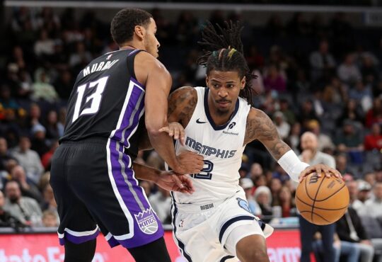 Ja Morant, a Kings trade target, drives to the basket against Sacramento's Keegan Murray