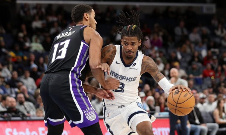 Ja Morant, a Kings trade target, drives to the basket against Sacramento's Keegan Murray