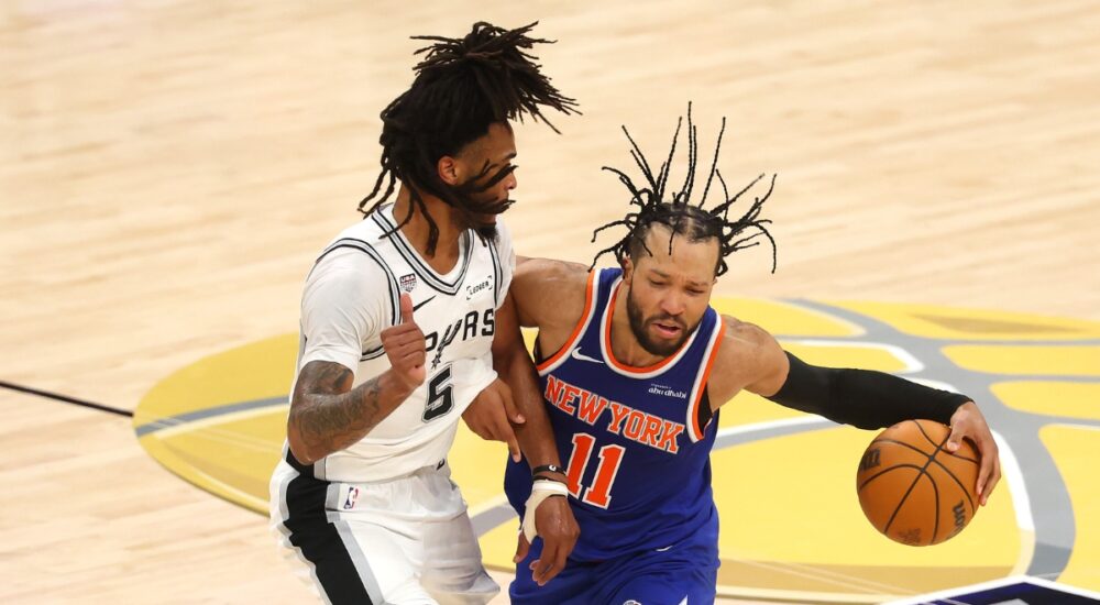 Jalen Brunson of the New York Knicks dribbles against Stephon Castle of the San Antonio Spurs during Game 2 of the 2026 NBA Finals.