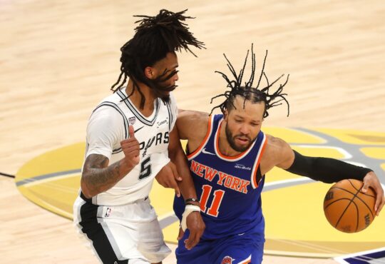 Jalen Brunson of the New York Knicks dribbles against Stephon Castle of the San Antonio Spurs during Game 2 of the 2026 NBA Finals.