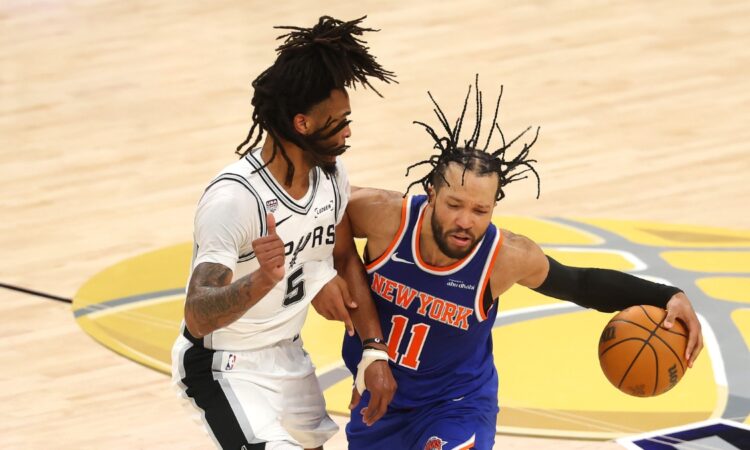 Jalen Brunson of the New York Knicks dribbles against Stephon Castle of the San Antonio Spurs during Game 2 of the 2026 NBA Finals.
