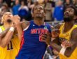 Detroit Pistons center Jalen Duren battles for position between Los Angeles Lakers center Jaxson Hayes and center Deandre Ayton during the second half at Little Caesars Arena