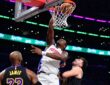 Detroit Pistons center Jalen Duren dunks against Los Angeles Lakers forward LeBron James and guard Luka Doncic during the first half at Crypto.com Arena.
