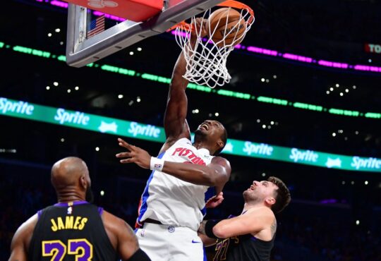 Detroit Pistons center Jalen Duren dunks against Los Angeles Lakers forward LeBron James and guard Luka Doncic during the first half at Crypto.com Arena.