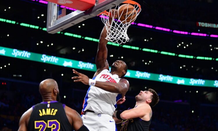 Detroit Pistons center Jalen Duren dunks against Los Angeles Lakers forward LeBron James and guard Luka Doncic during the first half at Crypto.com Arena.