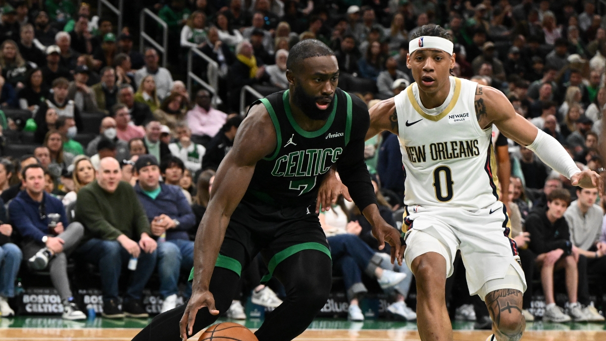 Jaylen Brown #7 of the Boston Celtics drives to the basket against Jeremiah Fears #0 of the New Orleans Pelicans at TD Garden.