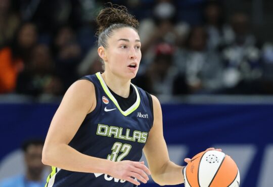 Jessica Shepard dribbles up the court for the Dallas Wings against the Chicago Sky.