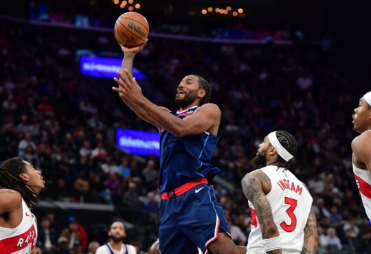 Los Angeles Clippers forward Kawhi Leonard shoots over Toronto Raptors forward Brandon Ingram during a 2026 game at Intuit Dome