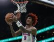 Kelly Oubre Jr. of the Philadelphia 76ers drives in for a layup against the Boston Celtics during the 2026 NBA Playoffs.