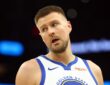 Golden State Warriors center Kristaps Porzingis on the court against the Phoenix Suns during the 2026 NBA play-in tournament at Mortgage Matchup Center in Phoenix.
