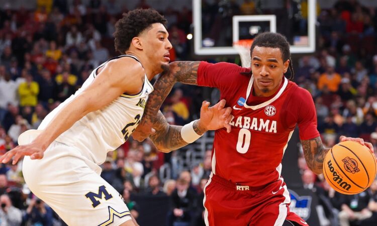 Labaron Philon, a Mavericks draft target, is defended by Michigan's Yaxel Lendeborg