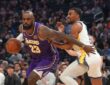 Los Angeles Lakers forward LeBron James drives with the ball against Golden State Warriors guard De'Anthony Melton in the first quarter at Chase Center.