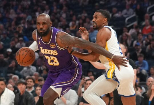 Los Angeles Lakers forward LeBron James drives with the ball against Golden State Warriors guard De'Anthony Melton in the first quarter at Chase Center.