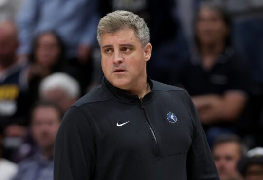 Minnesota Timberwolves assistant coach Micah Nori watching from the sideline during a 2024 playoff game against the Denver Nuggets