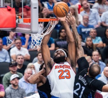 New York Knicks center Mitchell Robinson goes up to dunk against Dallas Mavericks center Daniel Gafford at American Airlines Center.