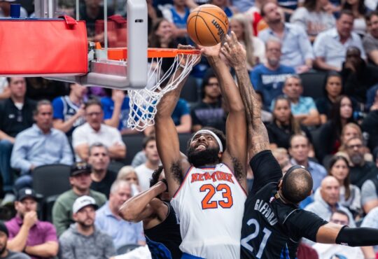 New York Knicks center Mitchell Robinson goes up to dunk against Dallas Mavericks center Daniel Gafford at American Airlines Center.
