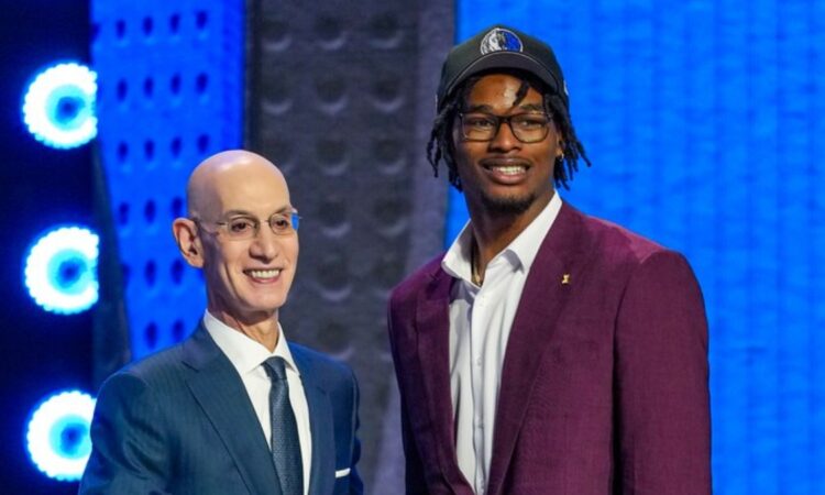 Morez Johnson Jr. wears a Dallas Mavericks cap and shakes hands with NBA Commissioner Adam Silver on stage after being selected No. 9 in the 2026 NBA Draft.