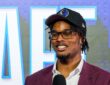 Morez Johnson Jr. smiles in a Dallas Mavericks cap and maroon suit while speaking on stage after being drafted No. 9 in the 2026 NBA Draft