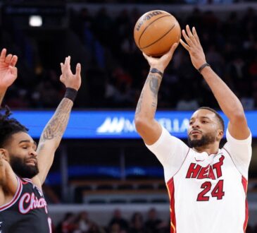 Miami Heat guard Norman Powell shoots against Chicago Bulls guard Coby White during the second half at United Center