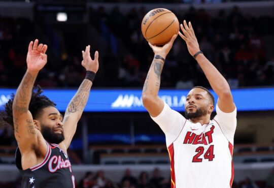 Miami Heat guard Norman Powell shoots against Chicago Bulls guard Coby White during the second half at United Center