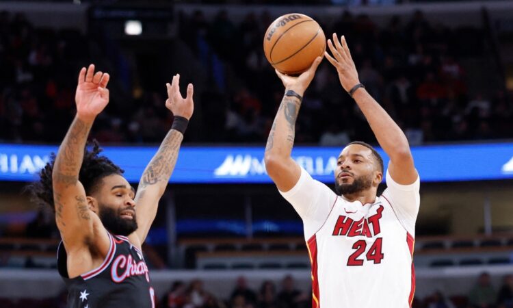 Miami Heat guard Norman Powell shoots against Chicago Bulls guard Coby White during the second half at United Center