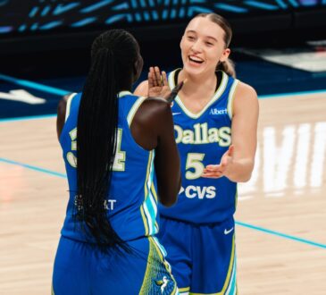 Dallas Wings guard Paige Bueckers celebrates with forward Awak Kuier during a WNBA game against the Las Vegas Aces at College Park Center in Arlington, Texas, on June 15, 2026.