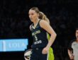 Dallas Wings guard Paige Bueckers dribbles the ball during a road game against the Minnesota Lynx
