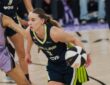 Dallas Wings guard Paige Bueckers drives past Golden State Valkyries forward Gabby Williams during a 2026 WNBA game