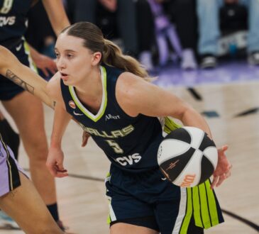 Dallas Wings guard Paige Bueckers drives past Golden State Valkyries forward Gabby Williams during a 2026 WNBA game