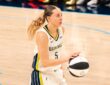 Paige Bueckers brings the ball up the court in a white Dallas Wings home uniform against the Phoenix Mercury on June 11, 2026