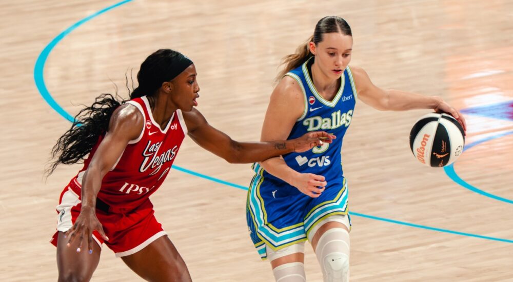 Paige Bueckers of the Dallas Wings drives the ball against a Las Vegas Aces defender