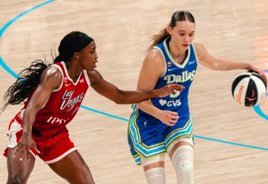 Paige Bueckers of the Dallas Wings drives the ball against a Las Vegas Aces defender