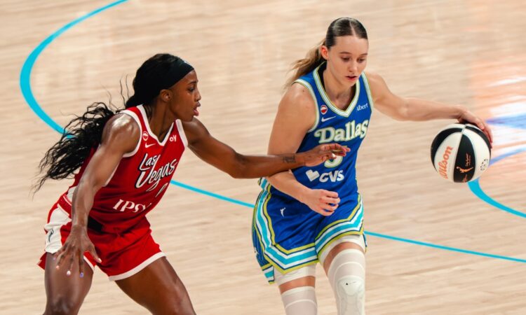 Paige Bueckers of the Dallas Wings drives the ball against a Las Vegas Aces defender