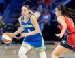 Dallas Wings guard Paige Bueckers dribbles while guarded by Washington Mystics guard Sonia Citron at College Park Center.