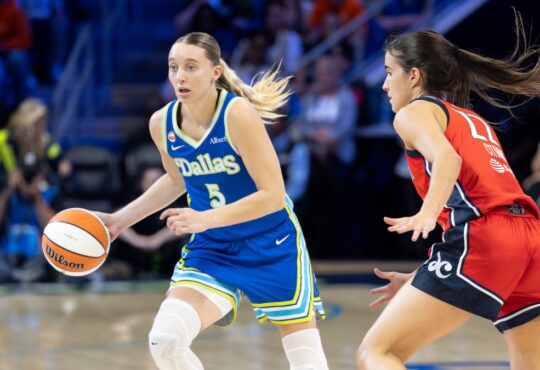 Dallas Wings guard Paige Bueckers dribbles while guarded by Washington Mystics guard Sonia Citron at College Park Center.