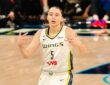 Paige Bueckers celebrates after a basket in a white Dallas Wings home uniform against the Phoenix Mercury on June 11, 2026