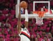 Robert Williams III of the Portland Trail Blazers converts an alley-oop dunk against the San Antonio Spurs in the 2026 NBA Playoffs